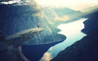 Woman on a cliff in Norway