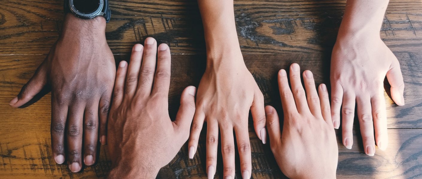 Hands of different people side by side